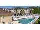 Inviting community pool surrounded by lounge chairs and well-maintained condo buildings at 698 Seabrook Ct # 103, Altamonte Springs, FL 32714