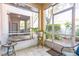 View of the screened porch featuring a tiled floor and access to an outdoor area at 698 Seabrook Ct # 103, Altamonte Springs, FL 32714