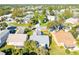 A beautiful aerial view of a home in a well-maintained neighborhood with mature trees and landscaping at 704 Sky Tree Ct, New Smyrna Beach, FL 32168