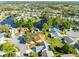 This aerial shows a lakeside community, showcasing the property's location in the neighborhood at 704 Sky Tree Ct, New Smyrna Beach, FL 32168