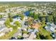 An aerial view shows a waterfront community, demonstrating the property's location within a neighborhood at 704 Sky Tree Ct, New Smyrna Beach, FL 32168