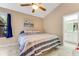 Inviting bedroom featuring tile floors, neutral walls, and a comfortable queen-size bed at 704 Sky Tree Ct, New Smyrna Beach, FL 32168