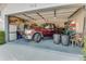 A spacious garage featuring ample storage space with a truck parked inside at 704 Sky Tree Ct, New Smyrna Beach, FL 32168