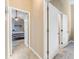 Hallway view showcasing entrances to bedroom and other rooms at 704 Sky Tree Ct, New Smyrna Beach, FL 32168