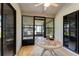Patio with sliding glass doors, blinds and table with puzzle set at 704 Sky Tree Ct, New Smyrna Beach, FL 32168
