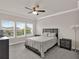 Inviting bedroom with large windows offering plenty of natural light and comfortable furnishings at 7166 Enchanted Lake Dr, Winter Garden, FL 34787