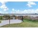 Scenic view of the lake with a wooden fishing pier, surrounded by lush landscaping at 7166 Enchanted Lake Dr, Winter Garden, FL 34787