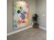 Colorful Mickey Mouse artwork on display, adding a touch of whimsy and personality to the entryway at 8008 Formosa Valley Pl, Kissimmee, FL 34747