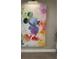 Bright and colorful abstract Mickey Mouse artwork provides a whimsical accent to the room at 8008 Formosa Valley Pl, Kissimmee, FL 34747