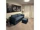 Cozy bedroom featuring comfortable seating, unique wall art, and ample natural light at 8008 Formosa Valley Pl, Kissimmee, FL 34747