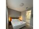 Cozy bedroom with a king-sized bed, modern lighting, and an ensuite bathroom providing a private retreat at 8008 Formosa Valley Pl, Kissimmee, FL 34747