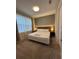 Cozy bedroom featuring a queen-size bed, plush carpet, and ambient lighting for a relaxing atmosphere at 8008 Formosa Valley Pl, Kissimmee, FL 34747