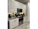 Modern kitchen with white cabinets, granite countertops, stainless steel appliances, and subway tile backsplash at 8008 Formosa Valley Pl, Kissimmee, FL 34747
