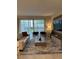 Inviting living room features a sofa, stylish chairs, and sliding doors that leads to an outdoor space at 8008 Formosa Valley Pl, Kissimmee, FL 34747
