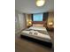Inviting main bedroom features a king bed, bedside tables, and natural light at 8008 Formosa Valley Pl, Kissimmee, FL 34747