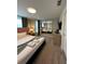 Inviting main bedroom features a king bed, bedside tables, and large mirrors creating spacious ambiance at 8008 Formosa Valley Pl, Kissimmee, FL 34747