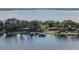 Aerial view of luxury homes along a scenic lakefront, highlighting their private docks and lush surroundings at 801 W 2Nd Ave, Windermere, FL 34786