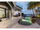 An entertainer's backyard featuring a covered patio with a built-in grill and a private swimming pool at 801 W 2Nd Ave, Windermere, FL 34786