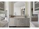 Stylish bar area with marble countertops, custom cabinetry, and elegant hardware, perfect for entertaining guests at 801 W 2Nd Ave, Windermere, FL 34786