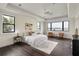 Spacious bedroom with views of the lake, hardwood floors, and neutral decor at 801 W 2Nd Ave, Windermere, FL 34786
