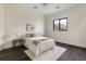 Inviting bedroom features a neutral palette, hardwood floors, and a view to the outside yard at 801 W 2Nd Ave, Windermere, FL 34786