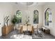 Elegant dining room with large windows, hardwood floors, and modern decor at 801 W 2Nd Ave, Windermere, FL 34786