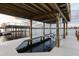 Exterior view of the boat dock and lift along the serene lake that sits next to a private dock at 801 W 2Nd Ave, Windermere, FL 34786