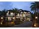 Elegant two-story home showcasing a paved driveway and beautifully landscaped front yard with palm trees at 801 W 2Nd Ave, Windermere, FL 34786