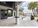 The backyard features a large patio, outdoor kitchen, and a custom pool overlooking the serene lake at 801 W 2Nd Ave, Windermere, FL 34786