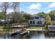 Stunning lakefront home with a private dock, lush landscaping, and elegant architecture at 801 W 2Nd Ave, Windermere, FL 34786