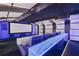 Deluxe home theater with premium seating, a projector, and an illuminated bar top at 801 W 2Nd Ave, Windermere, FL 34786