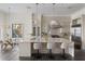 Spacious kitchen with a large center island, barstool seating, stainless steel appliances, and pendant lighting at 801 W 2Nd Ave, Windermere, FL 34786