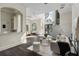 Open-concept living area featuring a contemporary staircase and an elegant chandelier at 801 W 2Nd Ave, Windermere, FL 34786