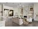 Bright living room with modern fireplace, hardwood flooring and a decorative accent wall at 801 W 2Nd Ave, Windermere, FL 34786