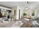 Open-concept living area with hardwood floors and views into the dining room at 801 W 2Nd Ave, Windermere, FL 34786