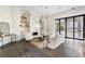 Elegant living room with a marble fireplace, stylish seating, and sliding glass doors leading to the outdoor space at 801 W 2Nd Ave, Windermere, FL 34786