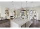 Open-concept living space showcasing a modern kitchen island, cozy living room area, and bright dining nook at 801 W 2Nd Ave, Windermere, FL 34786