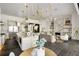 Expansive living space featuring a modern kitchen, cozy living room, and adjacent dining area with stylish decor at 801 W 2Nd Ave, Windermere, FL 34786