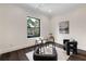 Bright office space with modern furniture, a glass desk, a cozy seating area, and a large window at 801 W 2Nd Ave, Windermere, FL 34786