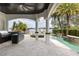 Expansive patio offers an outdoor kitchen, custom pool and spa, with views of the beautiful lake at 801 W 2Nd Ave, Windermere, FL 34786