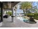 Enjoy the lake views from the expansive outdoor patio with a built-in kitchen and custom swimming pool at 801 W 2Nd Ave, Windermere, FL 34786