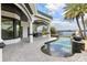 Enjoy outdoor living on the stone patio with an outdoor kitchen and beautiful pool overlooking the lake at 801 W 2Nd Ave, Windermere, FL 34786