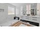 Beautifully designed bathroom featuring double vanity, modern fixtures, marble accents, and a spacious glass shower at 8010 Soldierwood St, Winter Garden, FL 34787