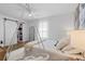 Bright bedroom featuring a bed with plush bedding and a walk-in closet accessible through a sliding barn door at 8010 Soldierwood St, Winter Garden, FL 34787