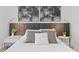 Bedroom with a comfortable queen bed featuring decor, bedside tables, and elegant sconces for a cozy retreat at 8010 Soldierwood St, Winter Garden, FL 34787