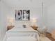 Cozy bedroom with a hanging chair, accent artwork, plush bedding, and soft lighting for a relaxing atmosphere at 8010 Soldierwood St, Winter Garden, FL 34787