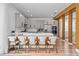 Modern kitchen with stainless steel appliances, a breakfast bar, and an open layout to the rest of the home at 8010 Soldierwood St, Winter Garden, FL 34787