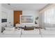 Cozy living room with a large sectional sofa, sleek entertainment center, and modern decor at 8010 Soldierwood St, Winter Garden, FL 34787