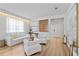 Bright living room featuring contemporary decor, wood floors, and modern furniture at 8010 Soldierwood St, Winter Garden, FL 34787