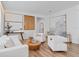 Bright living room featuring contemporary decor, wood floors, and modern furniture at 8010 Soldierwood St, Winter Garden, FL 34787